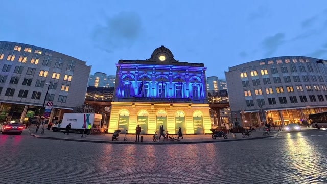 Four years of Russia's war of aggression against Ukraine: Lighting up of Station Europe buildings with colors of Ukrainian flag